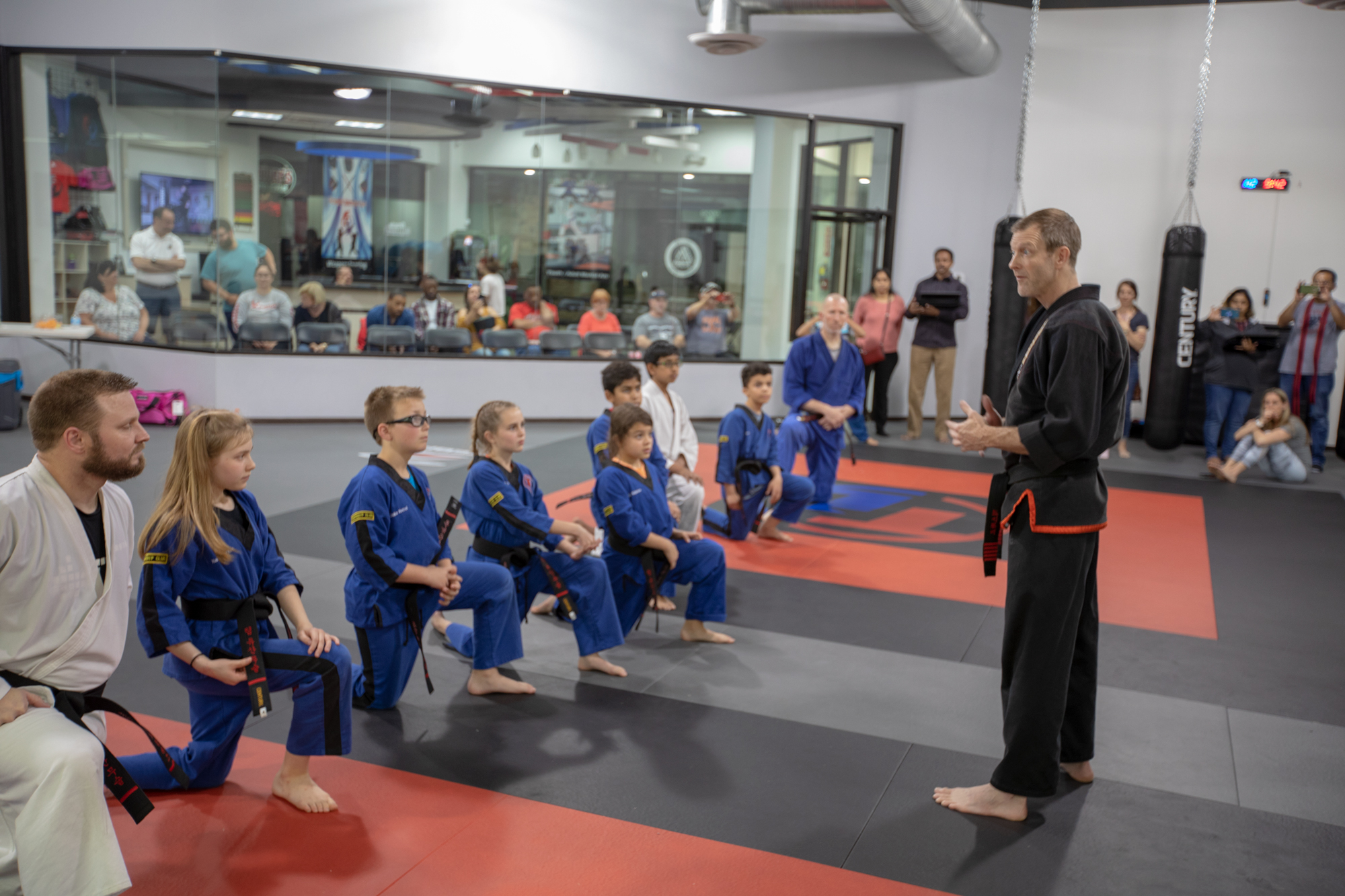 Head Master Instructor Scott Jones addressing new black belts martial arts katy